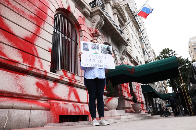 Tanzila Tumgoeva, from the Republic of Ingushetia, holds a protest sign as she stands in front of a vandalized Russian Consulate on September 30, 2022 in New York City. In a speech Russian President Vladimir Putin proclaimed that four Ukrainian regions will be part of Russia and become Russian citizens forever. Ukrainian President Volodymyr Zelensky announced that Ukraine will be formally applying for NATO membership under an accelerated procedure responding to the annexation of its territory. The U.S. also announced a round of new sanctions on Russia hitting its defense and technology sectors. 