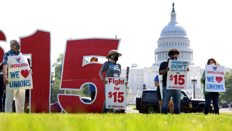 Labor activists hold a rally in support of raising the minimum wage to $15 an hour on the National Mall on May 19, 2021 in Washington, DC.