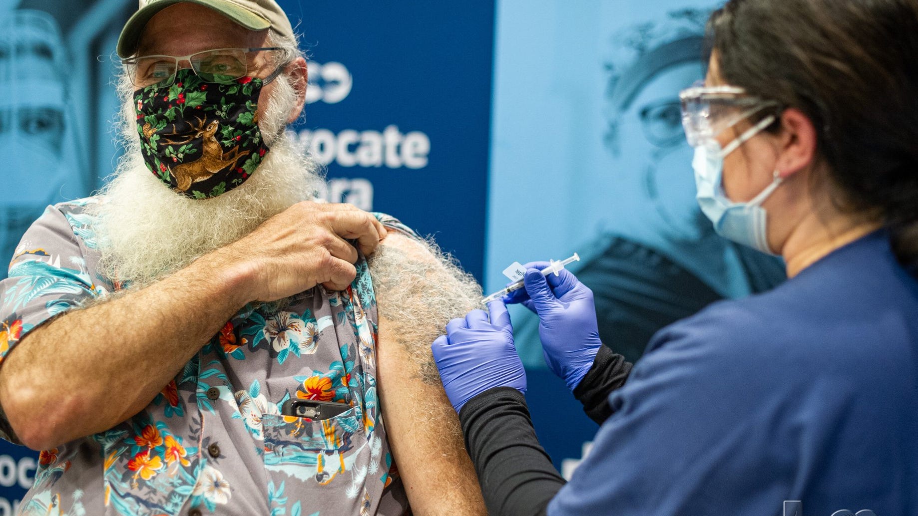 COVID survivor receives second vaccine dose from ER doctor who treated him