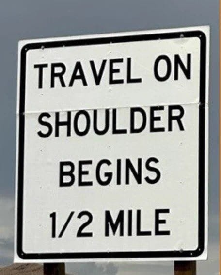 A sign informs drivers that the right shoulder is open to use