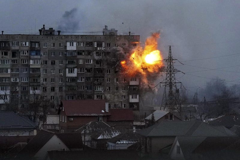 An apartment building explodes after a Russian army tank fires in Mariupol, Ukraine, March 11, 2022.