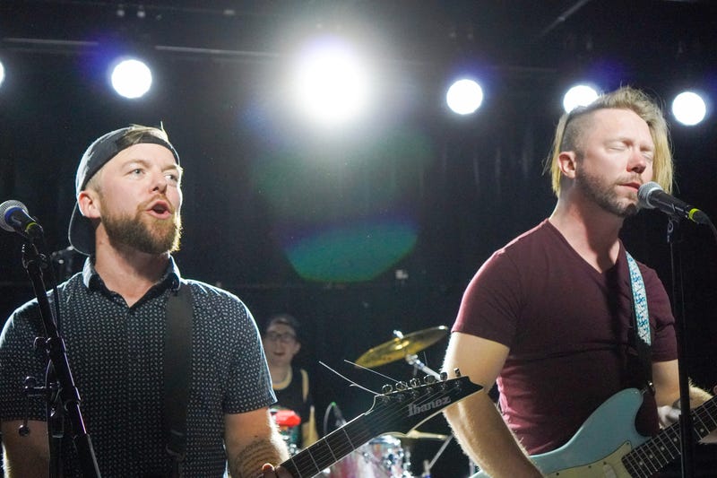 Pike playing guitar in his band Low Standards