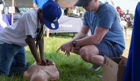 At Buffalo's 2022 Juneteenth celebration, the UB Department of Orthopaedics staffed a tent where they provided CPR/AED training to members of the the public.