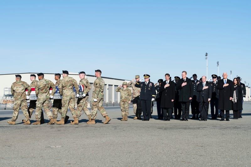 A U.S. Army carry team transfers the remains of Spc. Collette