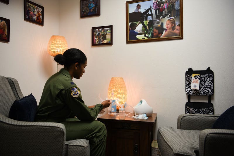 Capt. Ebony Godfrey, 20th Air Force nuclear command, control and communication operations chief, assembles a breast pump