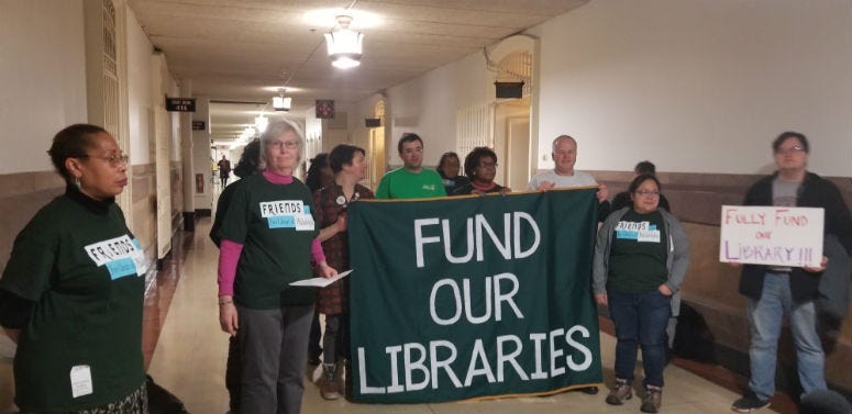 Alice Wells, second from left, paints a dire picture of neighborhood libraries, hobbled since the city cut budgets during the Great Recession.