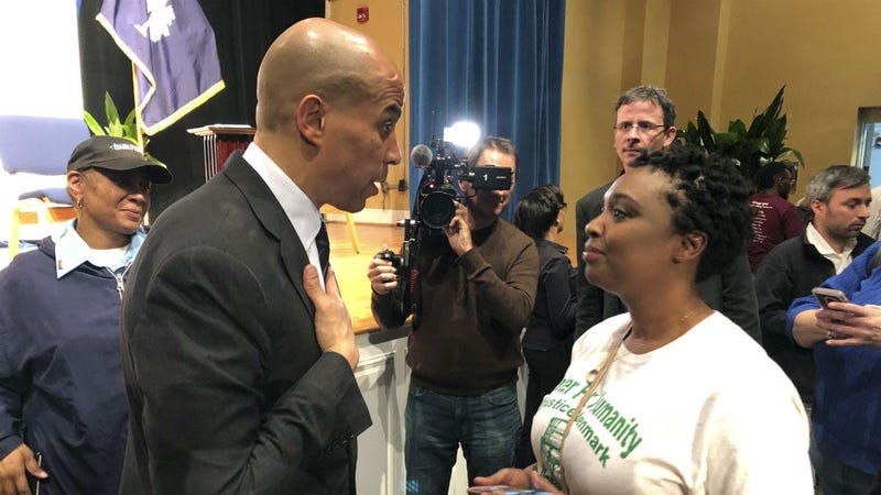 In this Feb. 10, 2019, file photo Sen. Cory Booker, D-N.J., talks with Deanna Miller Berry in Denmark, S.C. Several Democratic presidential candidates are trying to make a play for rural voters.