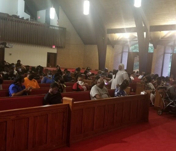 Residents hoping to cast ballots wait inside New Life Presbyterian Church in Atlanta Tuesday
