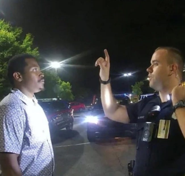 Rayshard Brooks is shown being administered test for DUI by APD officer Garrett Rolfe