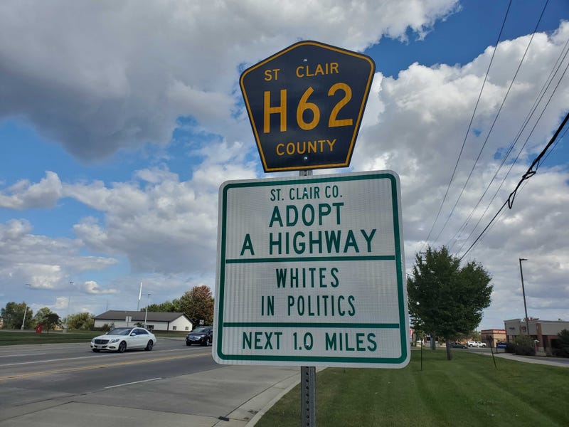 "Whites in Politics" displayed on an Adopt A Highway sign in St. Clair County Illinois