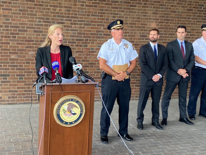 Acting U.S. Attorney Jennifer Arbittier Williams with members of the FBI and Philadelphia Police.