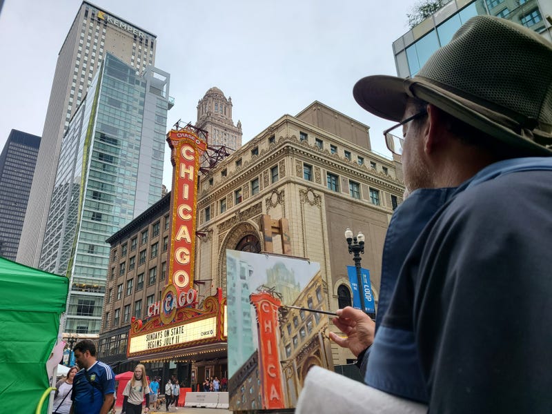 On the other end of the closure at Lake Street local artist RL Weber found some serenity in finally having the time to set up an easel and canvas in the middle of the street, completing an oil painting with the Chicago Theatre sign as his muse.