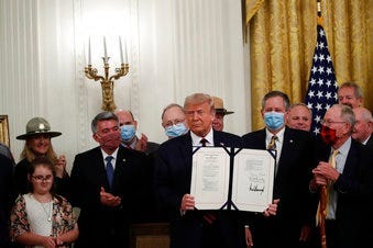 President Donald Trump poses for a photo during a signing ceremony for H.R. 1957 – "The Great American Outdoors Act," in the East Room of the White House, Tuesday, Aug. 4, 2020, in Washington. (AP Photo/Alex Brandon)