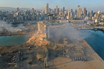 A drone picture shows the scene of an explosion at the seaport of Beirut, Lebanon, Wednesday, Aug. 5, 2020.  (AP Photo/Hussein Malla)