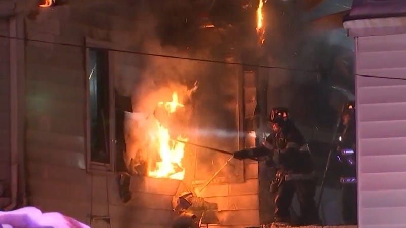 Firefighters battling a deadly rowhouse fire in Trenton late Sunday night.