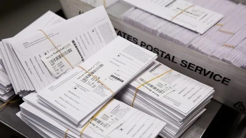 Sample voting ballots during training on a new ballot-sorting machine at the Board of Elections in Doylestown, Pennsylvania