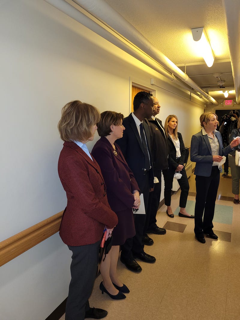 Senators tour a public housing building with new fire suppression systems 