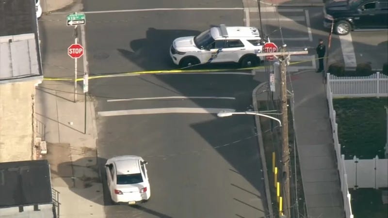 The crime scene where, police say, two teens were shot just two blocks from a makeshift memorial for Temple University police officer Christopher Fitzgerald.