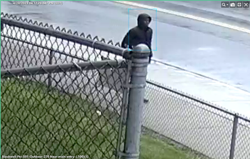 Suspect in Detroit shooting walking on the sidewalk