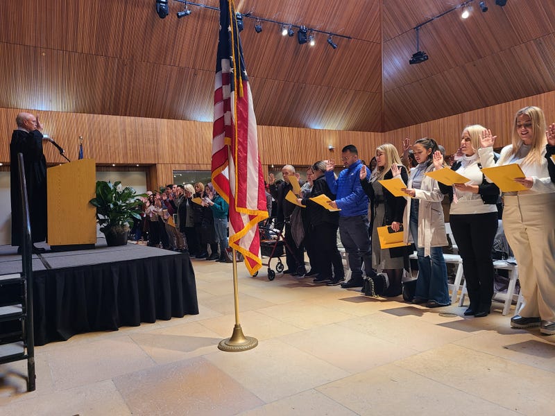 More than 100 people took the oath Monday to become naturalized U.S. citizens at the Chicago Botanic Garden.