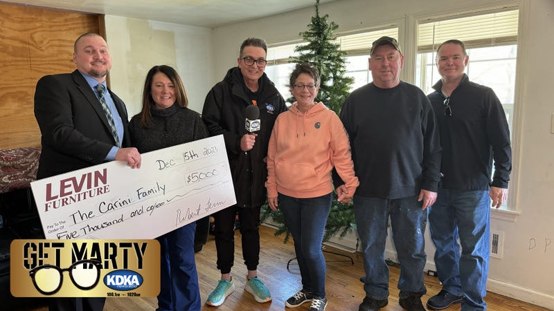 Rita Carini receives $5,000 surprise from Levin's Furniture & Mattress for Christmas.