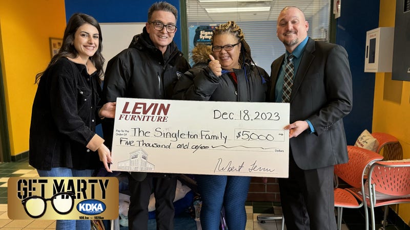 Marquita Singleton receives $5,000 surprise from Levin's Furniture & Mattress for Christmas.