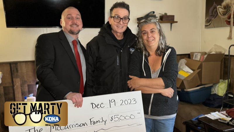 Angie McCarrison receives a $5,000 surprise from Levin's Furniture & Mattress for Christmas.