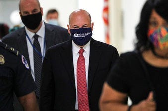 Postmaster General Louis DeJoy arrives to testify before a House Oversight and Reform Committee hearing on the Postal Service on Capitol Hill, Monday, Aug. 24, 2020, in Washington. (Tom Brenner/Pool via AP)