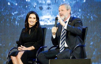 FILE -This Wednesday Nov. 28, 2018 file photo shows Rev. Jerry Falwell Jr., right, and his wife, Becky during after a town hall at a convocation at Liberty University in Lynchburg, Va. (AP Photo/Steve Helber)