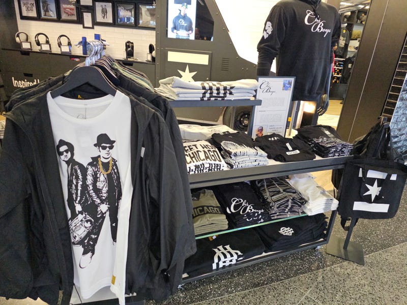 Clothing and apparel inside of a ChiBoys kiosk at O'Hare Airport.
