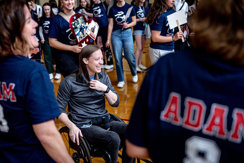 Paralympian Sarah Adam in the midst of supporters at a rally in her honor