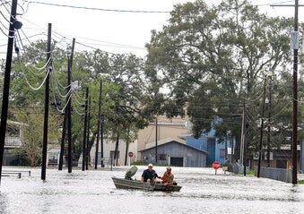 Boaters navigate a flooded road following Hurricane Laura, Thursday, Aug. 27, 2020 in Delcambre, La. (Brad Bowie/The Advocate via AP)