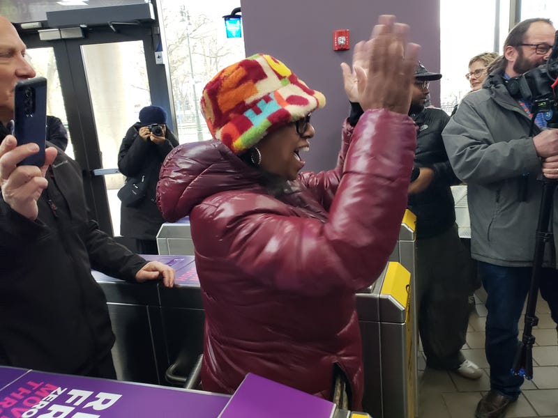 Lanetta Hinton celebrates as she becomes one millionth rider on Detroit People Mover this year