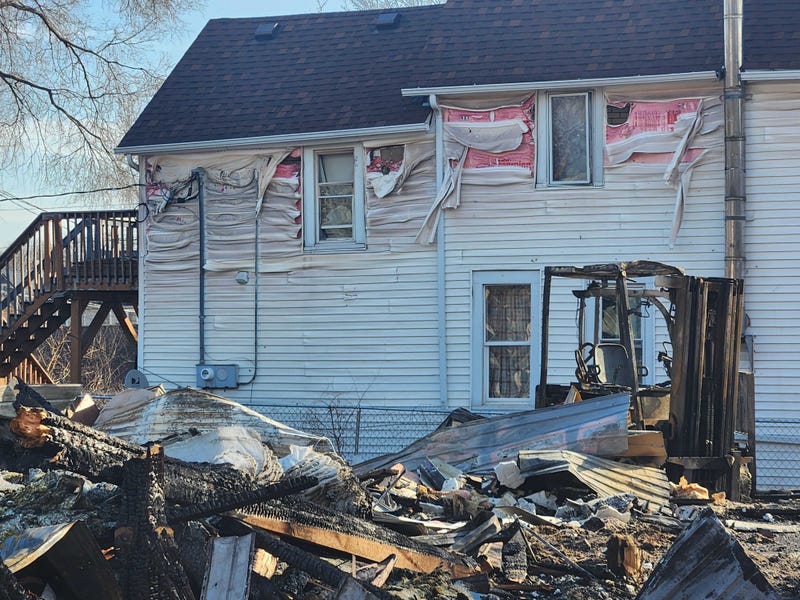 All that is left of the Fulton flooring building is a 15-foot high pile of burned rubble