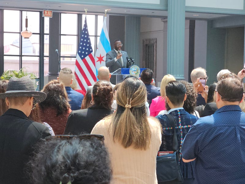 Chicago Mayor Brandon Johnson addresses a crowd of immigrants, advocates, and elected officials on Thur. June 5, 2025 at the 9th floor Winter Garden inside the city's Harold Washington Library.