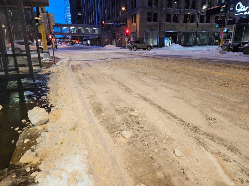 Roads in the Twin Cities are still covered with snow and ice with high winds and drifting making it difficult to get them clear Monday morning.