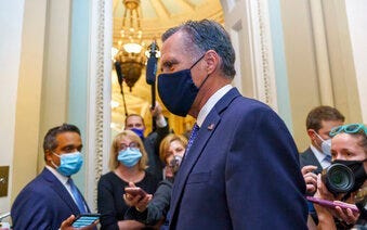 Sen. Mitt Romney, R-Utah, leaves the Senate Chamber following a vote, at the Capitol in Washington, Monday, Sept. 21, 2020. (AP Photo/J. Scott Applewhite)