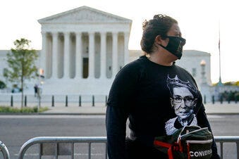 Kara Stewart of Martin, Ky., stands outside the Supreme Court in Washington, Wednesday, Sept. 23, 2020, before a private ceremony and public viewing of Justice Ruth Bader Ginsburg. Ginsburg, 87, died of cancer on Sept. 18. (AP Photo/Patrick Semansky)