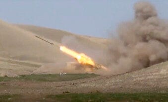 In this image taken from footage released by Azerbaijan's Defense Ministry on Sunday, an Azerbaijan's rocket launches from missile system at the contact line of the self-proclaimed Republic of Nagorno-Karabakh. (Azerbaijan's Defense Ministry via AP)