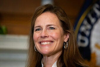 In this Oct. 1, 2020, photo, Supreme Court nominee Judge Amy Coney Barrett, meets with Sen. Roger Wicker, R-Miss., at the Capitol in Washington. (Graeme Jennings/Pool via AP)
