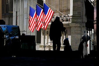 FILE - In this Oct. 14, 2020 file photo, pedestrians pass the New York Stock Exchange in New York. Stocks are ticking higher Wednesday, Nov. 11, and this time big technology stocks are rising too on Wall Street. (AP Photo/Frank Franklin II, File)