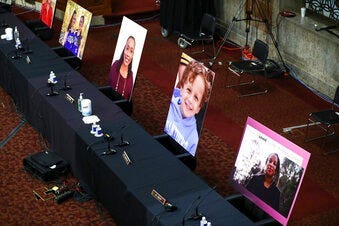 Images of people who've been helped by the Affordable Care Act (ACA) occupy the seats of Democratic senators boycotting a Senate Judiciary Committee business meeting on the nomination of Judge Amy Coney Barrett. (Hannah McKay/Pool via AP)