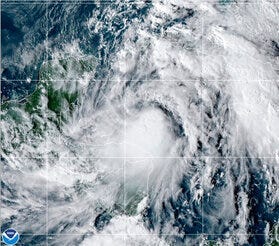 This satellite image provided by the National Oceanic and Atmospheric Administration shows Tropical Storm Zeta, Sunday, Oct. 25, 2020, at 2110 GMT (5:10 p.m. ET). (NOAA/NESDIS/STAR via AP)