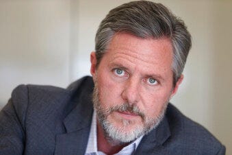 FILE - In this Nov. 16, 2016 file photo, Liberty University president Jerry Falwell Jr., poses during an interview in his offices at the school in Lynchburg, Va. (AP Photo/Steve Helber, File)