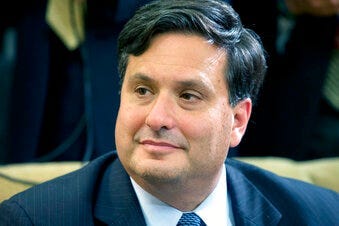 FILE - In this Wednesday, Oct. 22, 2014 file photo, Ebola coordinator Ron Klain listens as President Barack Obama speaks to the media about the government's Ebola response in the Oval Office of the White House. (AP Photo/Jacquelyn Martin, File)