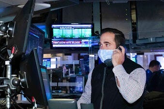 A trader at the New York Stock Exchange works at his terminal, Tuesday, November 24, 2020. (Nicole Pereira/NYSE via AP)