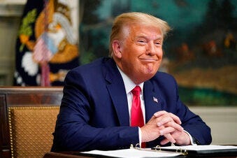 President Donald Trump participates in a video teleconference call with members of the military on Thanksgiving, Thursday, Nov. 26, 2020, at the White House in Washington. (AP Photo/Patrick Semansky)