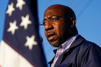 FILE - In this Nov. 15, 2020, file photo Raphael Warnock, a Democratic candidate for the U.S. Senate, speaks during a campaign rally in Marietta, Ga. (AP Photo/Brynn Anderson, File)