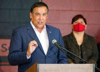 FILE - In this Tuesday, July 28, 2020 file photo, Columbus Mayor Andrew Ginther makes remarks. (Adam Cairns/The Columbus Dispatch via AP, File)