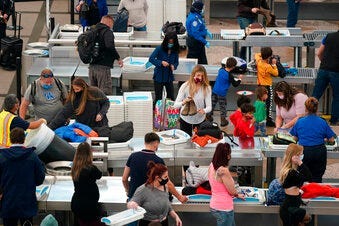 Airport Tuesday, Dec. 22, 2020, in Denver. (AP Photo/David Zalubowski)